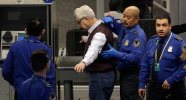 A Transportation Security Administration (TSA) officer pats down Elliott Erwitt as he works his way through security at San Francisco International Airport in San Francisco, Wednesday, Nov. 24, 2010. (AP Photo/Jeff Chiu)